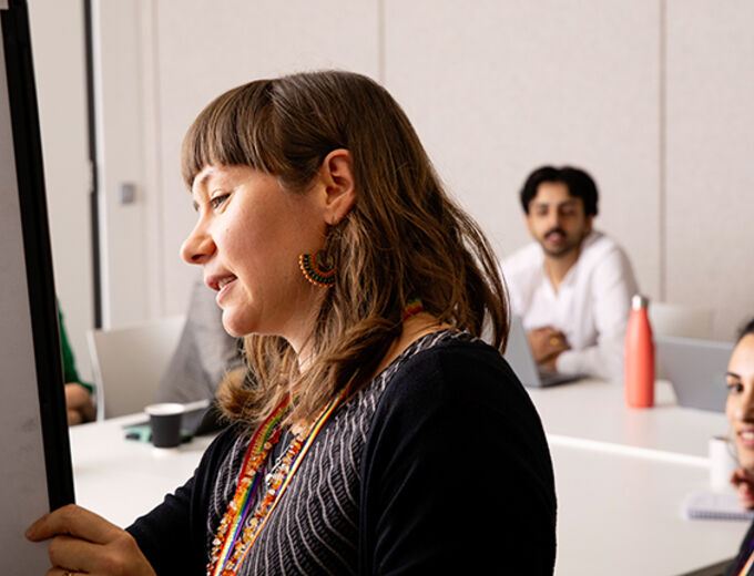 A University Student Wellbeing Counsellor is presenting in a mental health workshop at the Student Services Centre.